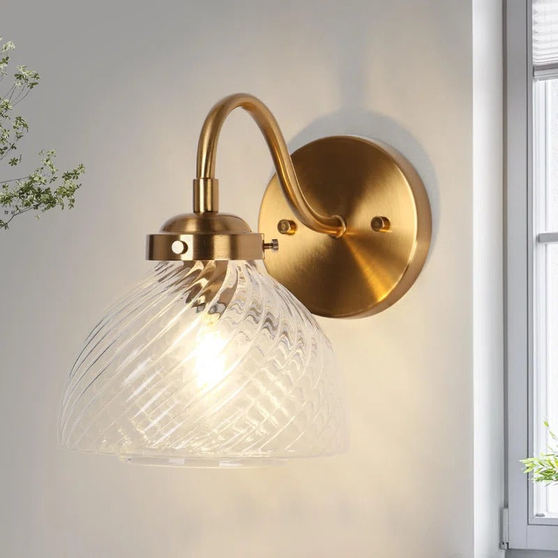 Elora Vintage Brass Swirled Glass Wall Sconce scene1.webp__PID:7c142ec8-48eb-4f9c-94b7-7522bbb9e1b0
