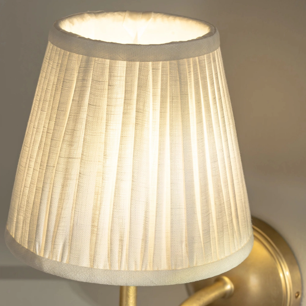 Finn Pleated Shade Brass Arm Wall Sconce2.webp__PID:78378a82-09f9-4f8a-86f0-e6cedd9b956d